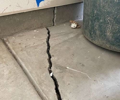 Cracked concrete foundation documented during a Houston-area foundation and structural inspection