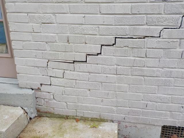 Visible foundation damage on a residential property inspected in the Greater Houston area