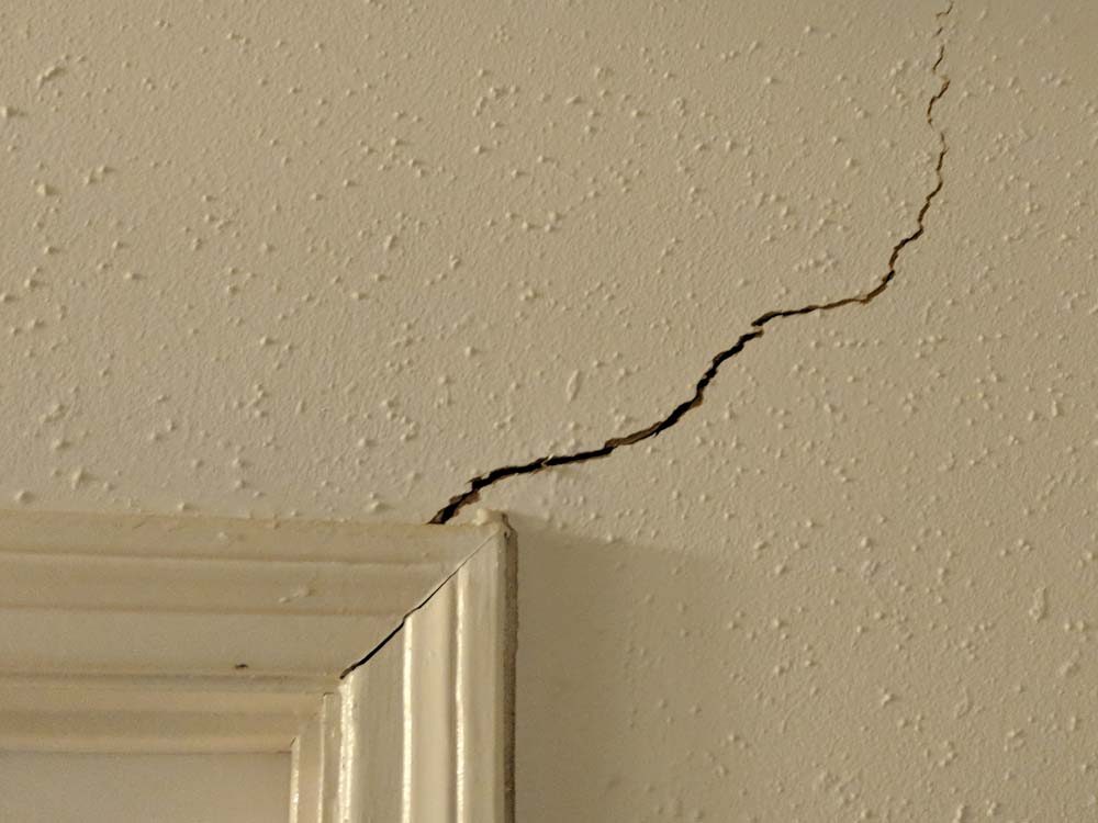 Interior sheetrock crack indicating possible foundation movement during a Houston home inspection