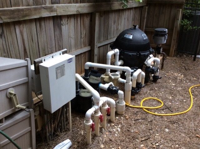 Pool and spa equipment inspection in Spring, Texas showing filter, pump, valves, and control panel