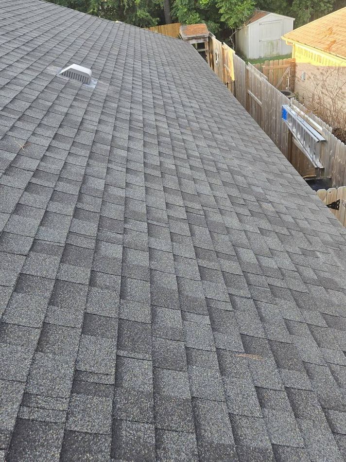 Gray architectural asphalt shingles and a roof vent photographed during a Spring, Texas home inspection